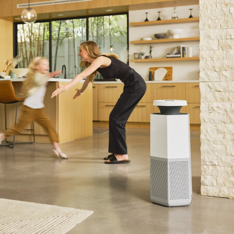 Puraclenz Core 750 whole house air purifier in a modern living space showing room-wide purification
