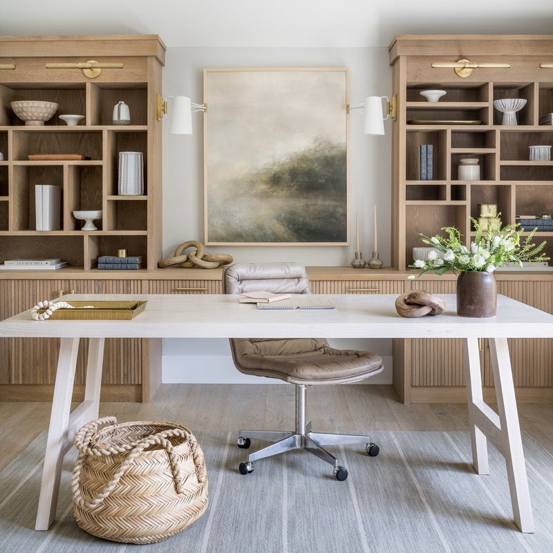 Modern American home office with built-in wood shelving and desk workspace illustrating furniture materials that may release VOCs into indoor air.